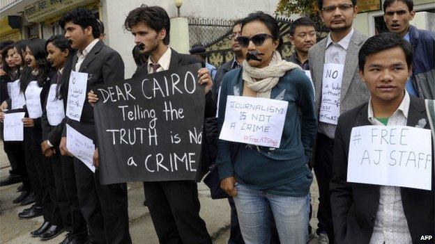 Nepalese journalists and law students demanding the release of journalists for al-Jazeera held in Egypt demonstrate outside the Egyptian embassy in Kathmandu, 24 March 2014