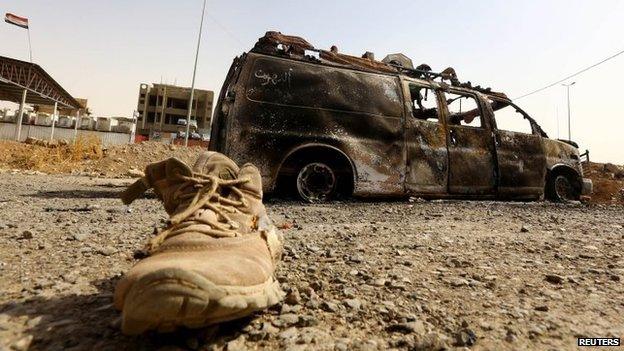 A burned out vehicle in Mosul