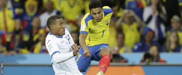 Luis Garrido of Honduras fights for the ball with Ecuador's Jefferson Montero (right)