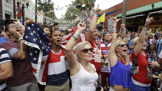 Fans cheer for the United States as they watch a World Cup soccer match between the United States and Portugal, in Orlando, Florida 22 June 2014