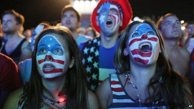 Fans with their faces painted with the US national soccer team's colours, watch a live telecast of the group G World Cup match between United States and Portugal, inside the FIFA Fan Fest area on Copacabana beach, in Rio de Janeiro, Brazil 22 June 2014