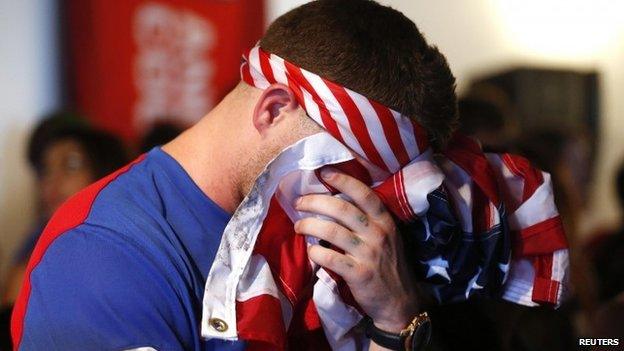 A USA soccer fan reacts after Portugal scored a second goal during the 2014 World Cup Group G soccer match between Portugal and the US at a viewing party in Los Angeles, California 22 June 2014