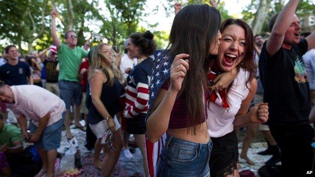 Allison DiFilippo, left, and Samantha Donat, both of New York, react as the United States went up 2-1 over Portugal in the second half as they watched the 2014 World Cup soccer match at a large screen public broadcast on Governor"s Island in New York, 22 June 2014