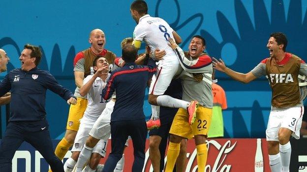 United States Clint Dempsey celebrates with his teammates after scoring his side's second goal during the group G World Cup soccer match between the USA and Portugal at the Arena da Amazonia in Manaus, Brazil, 22 June 2014