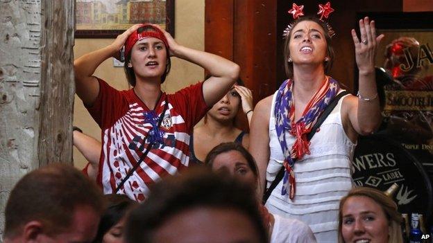 US soccer fans at The Claddagh Irish Pub in Pittsburgh react as Portugal scores to tie the score at 2-2 with less than one minute remaining during a World Cup soccer match against the United States in Brazil 22 June 2014