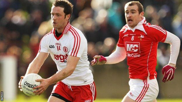 Tyrone forward Martin Penrose moves clear of Louth's Paddy Keenan