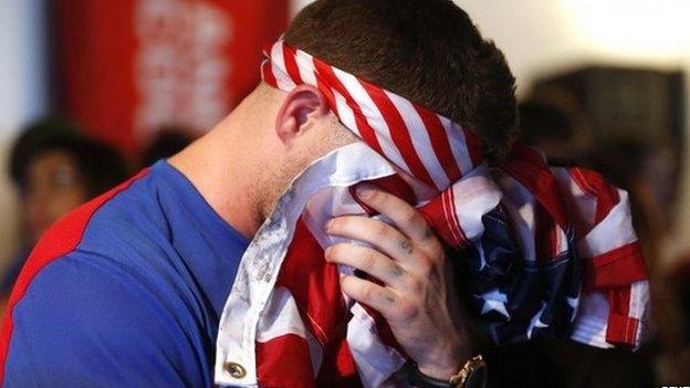 A USA soccer fan reacts after Portugal scored a second goal during the 2014 World Cup Group G soccer match between Portugal and the US at a viewing party in Los Angeles, California 22 June 2014