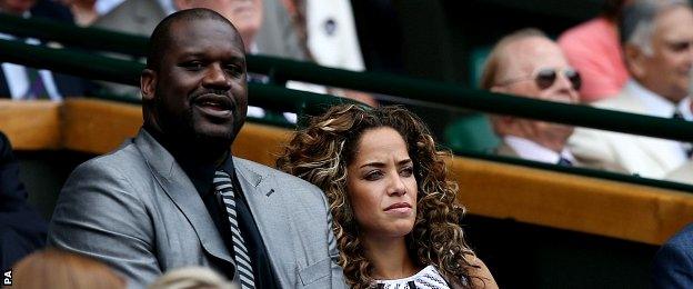 Shaquille O'Neal sits with Laticia Rolle