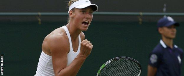 Belgium's Yanina Wickmayer celebrates winning a point against Australia"s Samantha Stosur