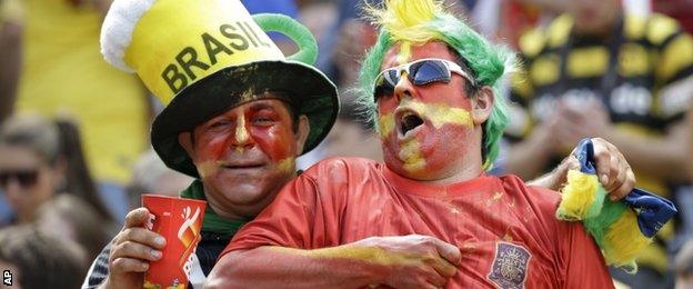 Spain fans watch the match against Australia in Curitiba