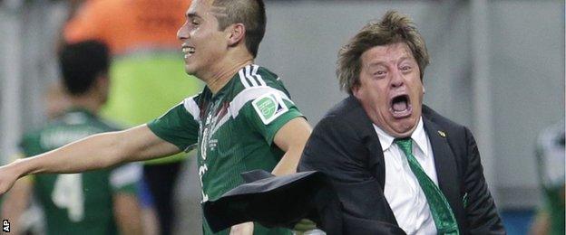 Mexico manager Miguel Herrera shows his delight after his side score against Croatia