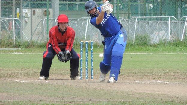 Jersey wicketkeeper Ed Farley looks on as Italy bat