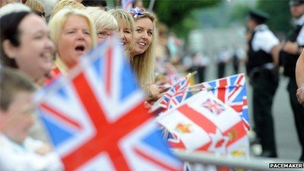 Members of the public carrying Union flags waited outside the jail for the Queen to arrive