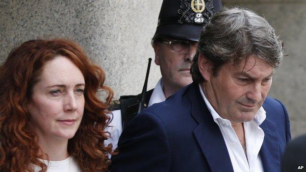 Rebekah and Charlie Brooks leave court on 24 June 2014