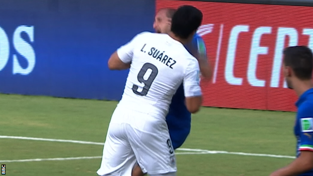 Luis Suarez appears to bite Giergio Chiellini