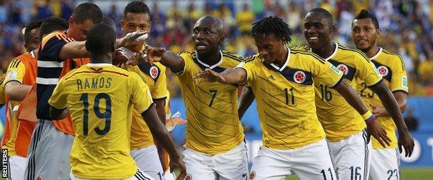 Colombia celebrate after Juan Cuadrado's penalty against Japan