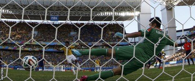 Colombia winger Juan Cuadrado scores a penalty against Japan