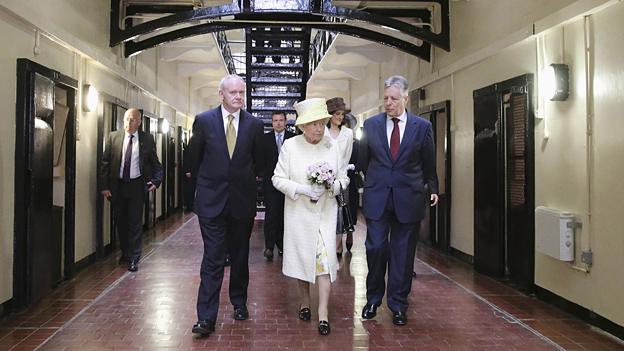 The Queen with Northern Ireland First Minister Peter Robinson, right, and Deputy First Minister Martin McGuinness on a visit to Belfast's Crumlin Road jail.