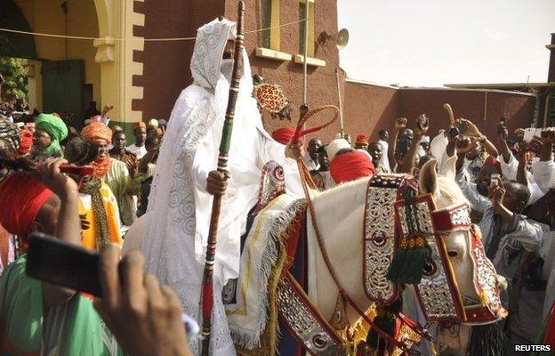 New emir of Kano Lamido Sanusi arrives at his palace on a horse in Kano city on 13 June 2014