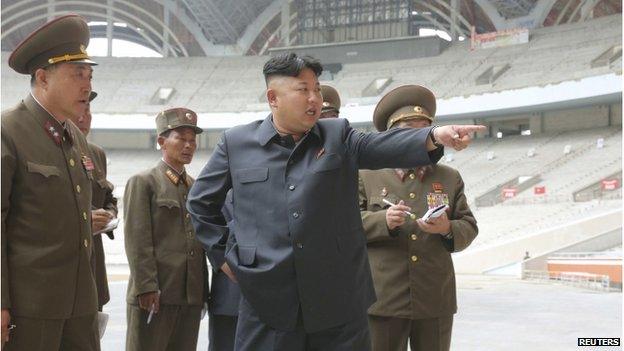 North Korean leader Kim Jong-un gives field guidance to the remodelling site of the May Day Stadium in this undated photo released by North Korea's Korean Central News Agency in Pyongyang on 20 June 2014.