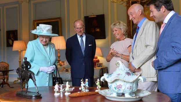 The Queen and the Duke of Edinburgh with Antiques Roadshow experts and some of the Hillborough Castle colection