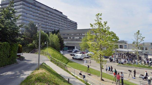 Television crews work in front of the University Hospital of the Canton of Vaud in Lausanne, 17 June 2014.