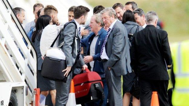 Roy Hodgson gets off the plane at Luton airport