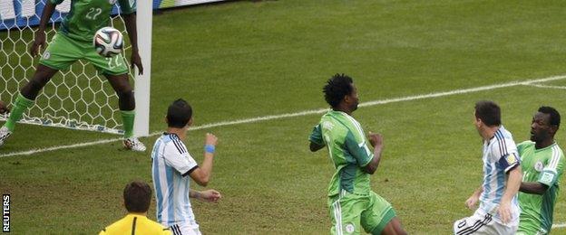 Argentina's Lionel Messi scores the first goal against Nigeria