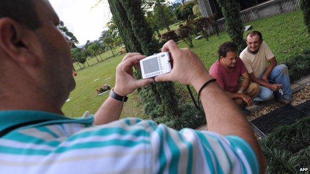 Tourists at Pablo Escobar's grave