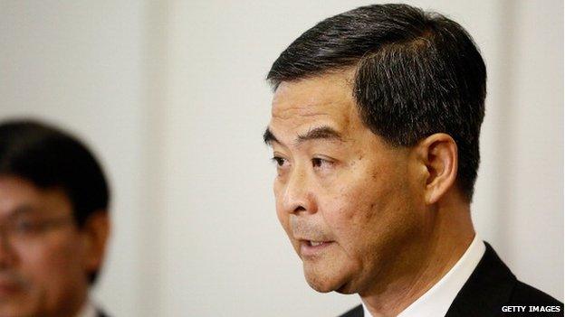 Hong Kong Chief Executive Leung Chun-ying speaks to Hong Kong journalists at a press conference during the APEC Summit on 6 October 2013 in Nusa Dua, Indonesia.