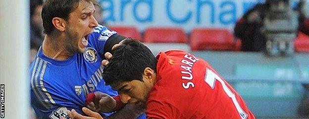 Luis Suarez tangles with Branislav Ivanovic