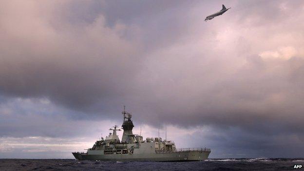 File photo: HMAS Perth transits through the southern Indian Ocean as an Orion P-3K of the Royal New Zealand Air Force searches for debris for missing Malaysia Airlines flight MH 370, 13 April 2014