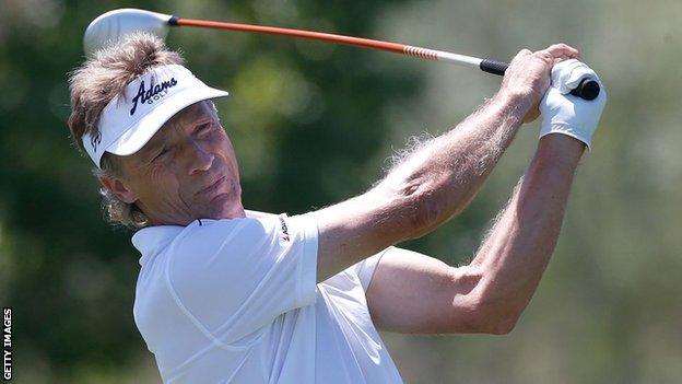 Bernhard Langer plays a shot