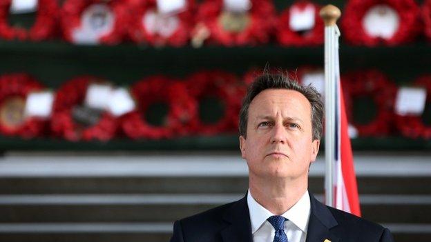 UK Prime Minister David Cameron looks on as he attends a "Last Post" ceremony at the Menin Gate in Ypres, on 26 June 2014