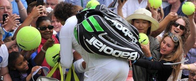 Rafael Nadal signs autographs