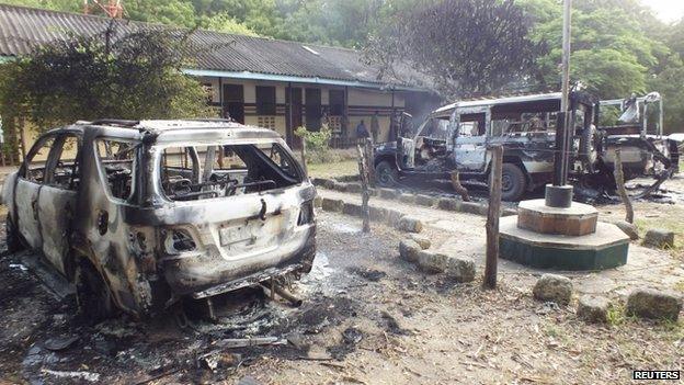 Wreckages of burnt cars are seen outside the Mpeketoni police station after unidentified gunmen attacked the coastal Kenyan town of Mpeketoni, 16 June 2014