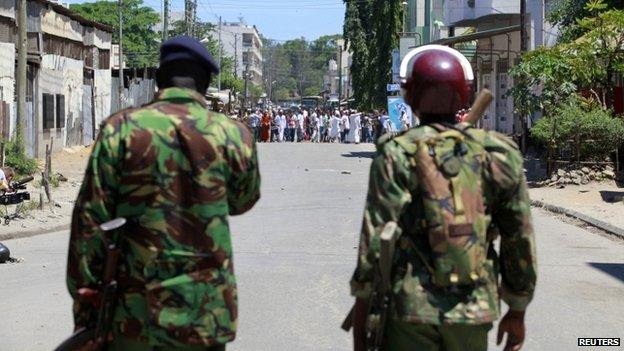 Riot police stand guard in Mombasa, Kenya, after Friday prayers - 4 April 2014