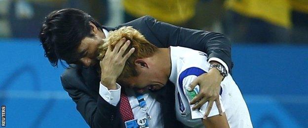 South Korea manager Hong Myung-bo consoles one of his players