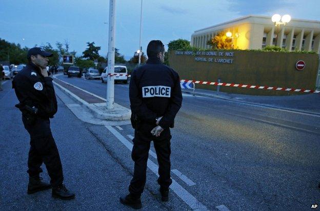 Police outside the hospital where Helene Pastor and her driver were shot in the French city of Nice, 6 May