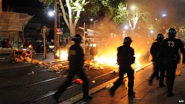 French police take position after Algeria's football fans celebrate on the Canebiere in Marseille, France - 26 June 2014