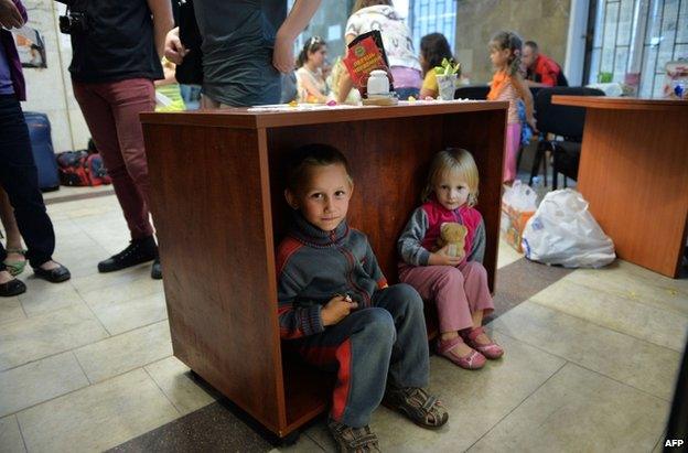 Children playing in the administrative headquarters of the self-proclaimed Donetsk People's Republic in Donetsk, 12 June