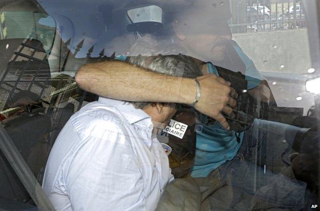 Wojciech Janowski leaves a police station in Nice, France, 27 June