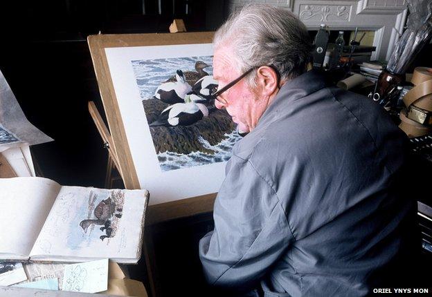 Charles Tunnicliffe at work in his home at Malltraeth