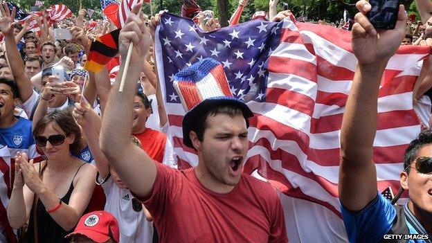 Fans cheer on the US football team during its World Cup match against Germany on 26 June.