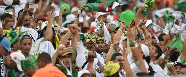 Algeria fans celebrate reaching the last 16 for the first time