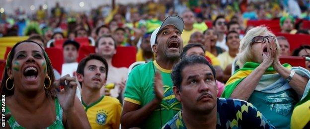 Brazil fans watch their team on a big screen