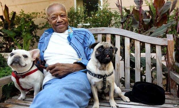 Bobby Womack sits with his dogs, a French bull dog named Music, left, and a pug named Wo - 22 June 2012