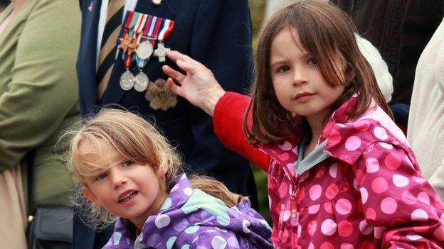 Children watch the parade