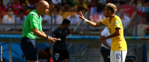 English referee Howard Webb and Brazil's Neymar