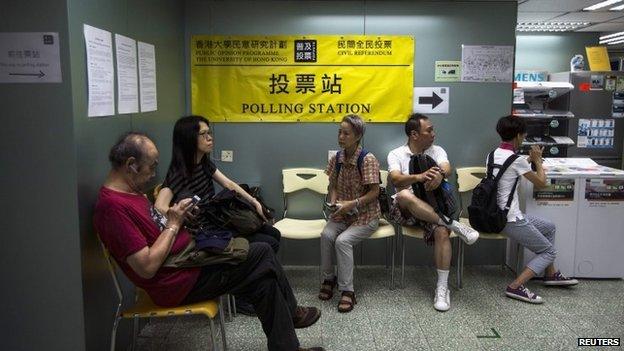 People wait to vote at a polling station in Hong Kong. Photo: 29 June 2014